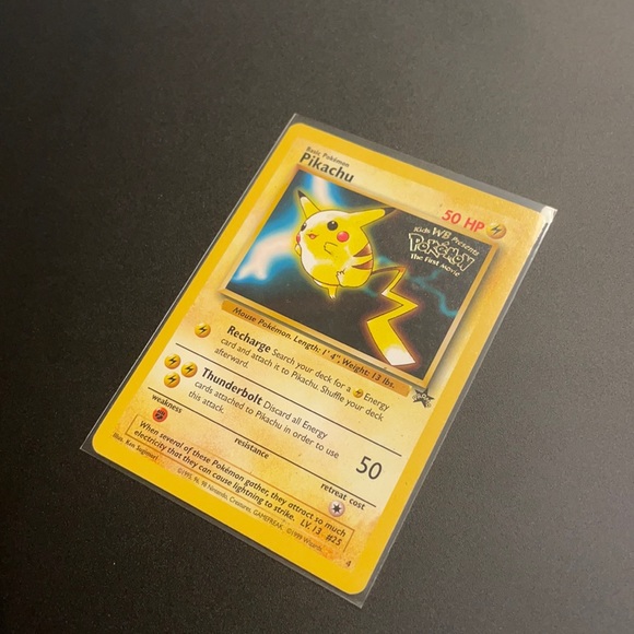 pokemon the first movie pikachu card Pokémon Card First Movie #28 The Chase For Pikachu Blue Logo 1st Print –  AGS Collectibles